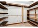Walk in closet with custom built shelving and wood trim at 101 Applecross Dr, Brownsburg, IN 46112