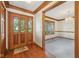 The foyer welcomes you with wood trim, hardwood floors, and a bright view into the living area at 101 Applecross Dr, Brownsburg, IN 46112