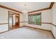Living room features trim and a view of the front yard through a window at 101 Applecross Dr, Brownsburg, IN 46112