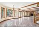 Spacious living room features tile flooring, wood trim, and a cozy brick fireplace, creating a warm, inviting atmosphere at 101 Applecross Dr, Brownsburg, IN 46112