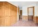 Unfurnished room featuring paneled walls, wood trim and tile flooring at 101 Applecross Dr, Brownsburg, IN 46112