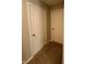 Hallway with carpeted flooring and neutral walls, leading to various rooms at 10931 N Longbranch St, Monrovia, IN 46157