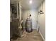 Utility room showcasing the home's water heater, furnace, and other mechanical systems at 10931 N Longbranch St, Monrovia, IN 46157