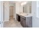 Bathroom featuring double sinks, ample counter space, and a glass enclosed shower at 1107 Stubble Run, Danville, IN 46122
