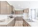Contemporary kitchen equipped with sleek countertops, stainless steel appliances, and ample storage at 1107 Stubble Run, Danville, IN 46122
