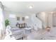 Bright living room with plush seating, neutral decor and staircase at 1107 Stubble Run, Danville, IN 46122