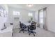 Home office featuring neutral walls, two windows, carpeting, and a conference table with chairs at 1107 Stubble Run, Danville, IN 46122