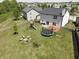 Aerial view of backyard with trampoline, playground, and outdoor seating area at 11155 Funny Cide Dr, Noblesville, IN 46060