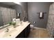 Bathroom featuring double sinks, granite countertops, and a shower with decorative curtains at 11155 Funny Cide Dr, Noblesville, IN 46060
