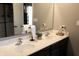 Bathroom with double sink vanity, quartz countertops, and a large mirror at 11155 Funny Cide Dr, Noblesville, IN 46060