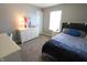 Bedroom with neutral decor and carpet, featuring a comfortable bed and dresser at 11155 Funny Cide Dr, Noblesville, IN 46060