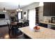 Open concept kitchen and dining area with granite countertops and stainless steel appliances at 11155 Funny Cide Dr, Noblesville, IN 46060