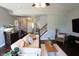Spacious living room with hardwood floors, a fireplace and lots of natural light at 11155 Funny Cide Dr, Noblesville, IN 46060
