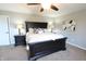 Comfortable main bedroom featuring a ceiling fan and decorative lamps on both nightstands at 11155 Funny Cide Dr, Noblesville, IN 46060
