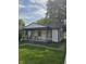 Inviting one-story house featuring a covered front porch and freshly cut grass at 114 S Catherwood Ave, Indianapolis, IN 46219