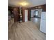 An open living area with updated flooring, vintage heating system and contrasting trim throughout at 114 S Catherwood Ave, Indianapolis, IN 46219