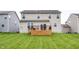 Backyard showcasing a wooden deck area and views of the home's siding at 11818 Bellhaven Dr, Fishers, IN 46038