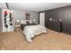 View of carpeted bedroom with comfortable bedding, dresser, and gray walls at 11818 Bellhaven Dr, Fishers, IN 46038