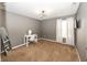 This bright bedroom includes plush carpet, neutral walls, and a modern light fixture for a contemporary feel at 11818 Bellhaven Dr, Fishers, IN 46038