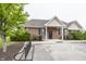 View of the building exterior, with landscaping, bike rack and accessible parking at 11818 Bellhaven Dr, Fishers, IN 46038