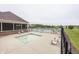 View of the community pool and recreational area with outdoor lounge chairs at 11818 Bellhaven Dr, Fishers, IN 46038
