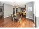 Modern dining room features stylish chandelier lighting, hardwood floors, and gray wall paint at 11818 Bellhaven Dr, Fishers, IN 46038