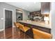 Spacious kitchen with a granite island, stainless steel appliances and views into the workout room at 11818 Bellhaven Dr, Fishers, IN 46038