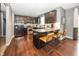 Kitchen with stainless steel appliances, granite countertops, dark cabinets, and seating at the island at 11818 Bellhaven Dr, Fishers, IN 46038