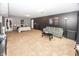 Spacious living room featuring carpet, a comfortable couch, and recreational decor at 11818 Bellhaven Dr, Fishers, IN 46038