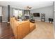 Comfortable living room with a fireplace, plush sofa, and modern decor, ideal for relaxation at 11818 Bellhaven Dr, Fishers, IN 46038