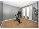 Home workout room with stationary bicycle and wall-mounted televisions at 11818 Bellhaven Dr, Fishers, IN 46038