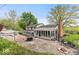 Overhead view of the backyard that features a patio, seating area, pool, and the house at 1242 W Huntsville Rd, Pendleton, IN 46064