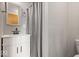 This bathroom features a shower with gray and white tile, a white vanity, and a built-in mirror cabinet at 1242 W Huntsville Rd, Pendleton, IN 46064