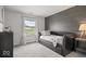 Comfortable bedroom featuring carpet, natural light, and an accent wall at 1242 W Huntsville Rd, Pendleton, IN 46064
