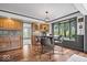 Stylish dining area featuring wooden floors, modern lighting, and a charming bay window for a cozy atmosphere at 1242 W Huntsville Rd, Pendleton, IN 46064