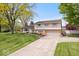 Two-story home with attached garage, mature trees and a well-maintained lawn at 1242 W Huntsville Rd, Pendleton, IN 46064