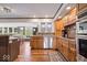 Modern kitchen featuring stainless steel appliances, wooden cabinetry, and an open design for cooking and entertaining at 1242 W Huntsville Rd, Pendleton, IN 46064
