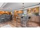 Inviting kitchen featuring wooden cabinetry, granite countertops, and an island with seating for casual dining at 1242 W Huntsville Rd, Pendleton, IN 46064
