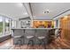 Open kitchen with an island and bar stool seating, complemented by wooden cabinets and views of the outdoors at 1242 W Huntsville Rd, Pendleton, IN 46064