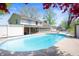 A backyard view of the house with an in-ground swimming pool and white fence at 1242 W Huntsville Rd, Pendleton, IN 46064