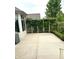Concrete patio with a trellis covered in greenery, part of a beautifully landscaped backyard at 12739 Kiawah Dr, Carmel, IN 46033