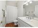 Cozy bathroom with wooden floors and features a tub shower with a curtain at 12739 Kiawah Dr, Carmel, IN 46033