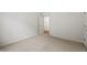 Bedroom featuring neutral carpet, white walls and a doorway entrance into another room at 12739 Kiawah Dr, Carmel, IN 46033