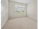 Bright bedroom with neutral carpet features a large window providing natural light at 12739 Kiawah Dr, Carmel, IN 46033