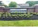 Elegant community entrance sign for Augusta at Plum Creek Farms with brick base and manicured flower beds at 12739 Kiawah Dr, Carmel, IN 46033