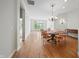 Bright dining room with hardwood floors and chandelier lighting at 12739 Kiawah Dr, Carmel, IN 46033