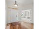 Bright foyer with hardwood floors, white trim, and entry to office at 12739 Kiawah Dr, Carmel, IN 46033