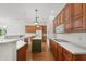 Open-concept kitchen features stainless steel appliances, custom cabinets, and a center island perfect for entertaining at 12739 Kiawah Dr, Carmel, IN 46033