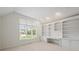 Office features custom built-ins, large window, and neutral carpet at 12739 Kiawah Dr, Carmel, IN 46033