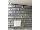 Close-up reveals an elegant gray tiled backsplash, adding a touch of modern sophistication to the kitchen at 1327 Union St, Columbus, IN 47201